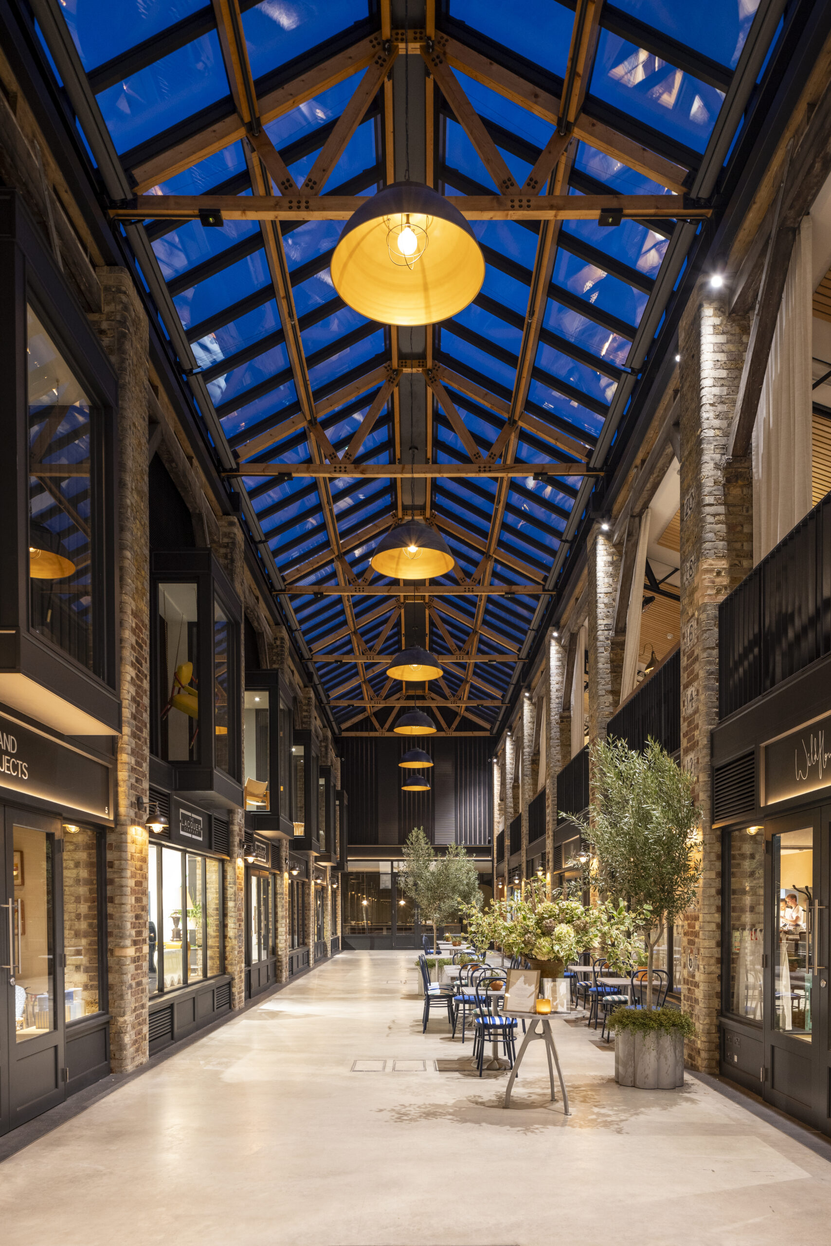 Newson's Yard, London, Pimlico Road, TESS 100 Blinds Refurbished building, retail, destination. Night time,, evening, rooflight. glow.